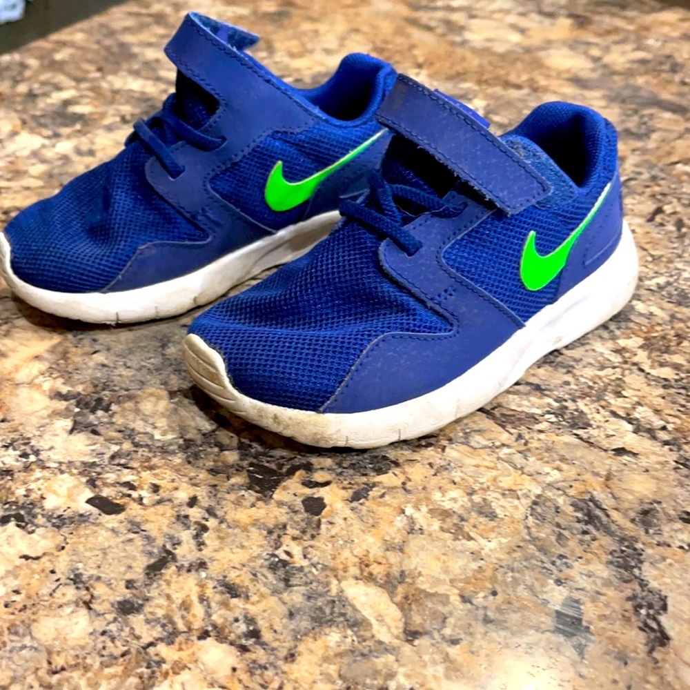 Blue and green Nike shoes